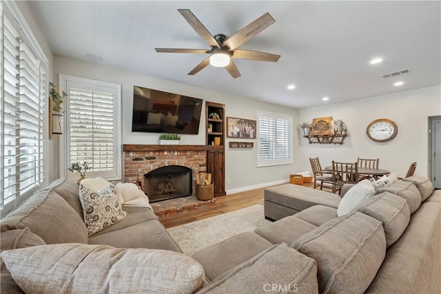 28433 Pinewood Ct, Saugus, CA 91390 - living room with ceiling fan, wood finished floors, a brick fireplace, and recessed lighting