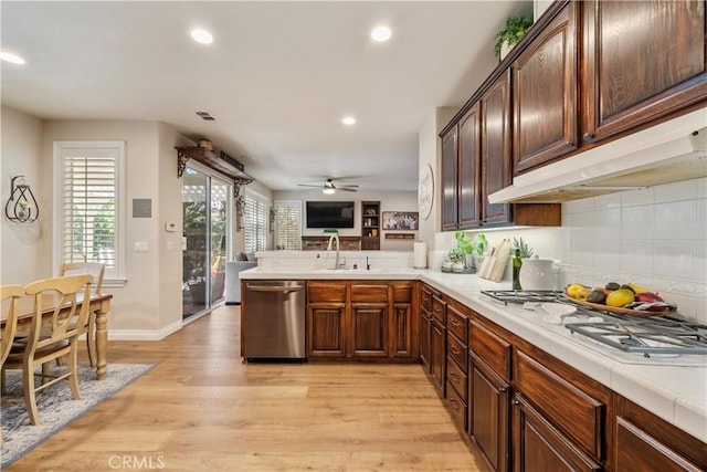 28433 Pinewood Ct, Saugus, CA 91390 - kitchen featuring stainless steel dishwasher, white gas stovetop, recessed lighting, light wood-style flooring, and backsplash