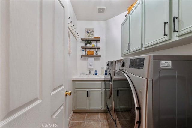 28433 Pinewood Ct, Saugus, CA 91390 - laundry room featuring cabinet space, washing machine and clothes dryer, and light tile patterned flooring