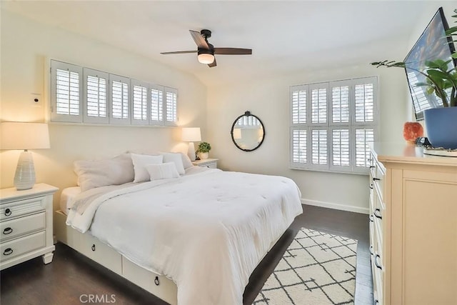 bedroom with baseboards, multiple windows, and ceiling fan
