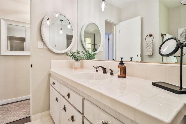 bathroom featuring vanity and baseboards