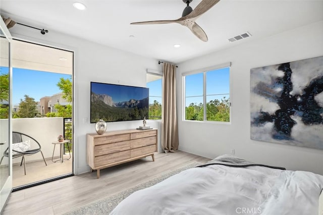 145 Novel, Irvine, CA 92618 - bedroom featuring access to outside, visible vents, wood finished floors, and recessed lighting
