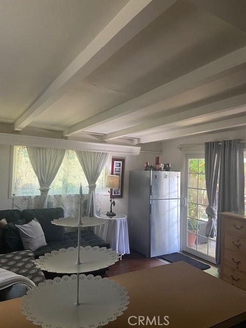 20243 Bassett St, Winnetka, CA 91306 - living room featuring beam ceiling and wood finished floors