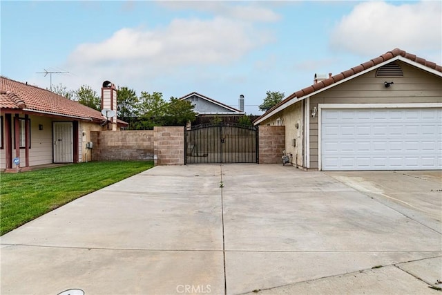 510 Monika Ct, Beaumont, CA 92223 - exterior space with fence, a gate, concrete driveway, a lawn, and a tile roof