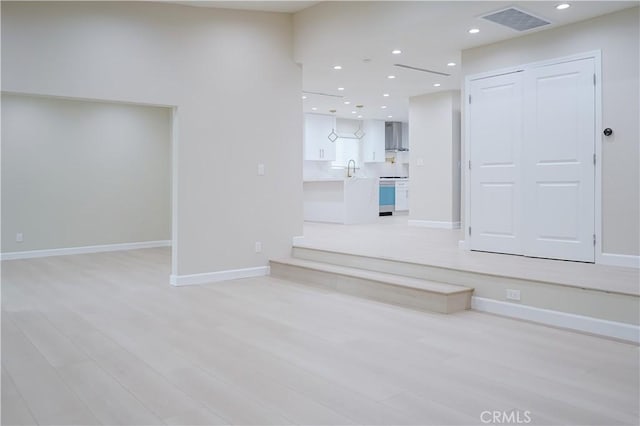 16840 Superior St, Northridge, CA 91343 - unfurnished living room featuring recessed lighting, baseboards, and light wood finished floors