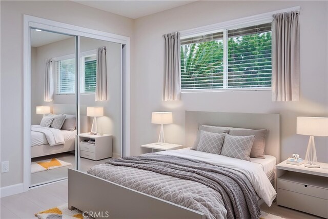 16840 Superior St, Northridge, CA 91343 - bedroom featuring multiple windows, a closet, and baseboards