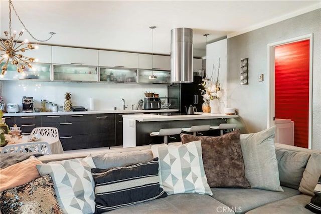 360 Obispo Ave Unit 15, Long Beach, CA 90814 - kitchen featuring modern cabinets, open floor plan, glass insert cabinets, high quality fridge, and a chandelier