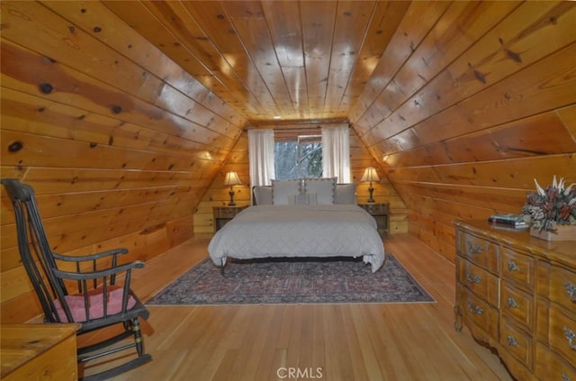 bedroom featuring wood walls, lofted ceiling, hardwood / wood-style flooring, and wooden ceiling