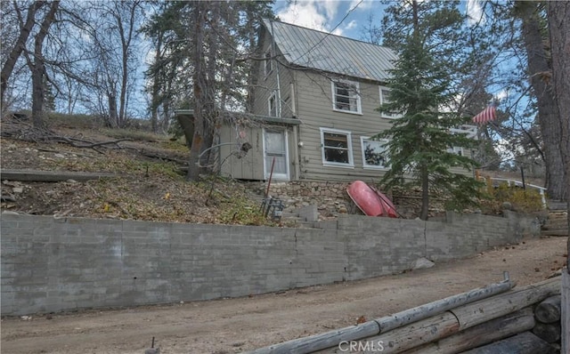 view of front of property featuring metal roof