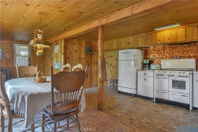 dining space with wood ceiling, brick floor, and wood walls
