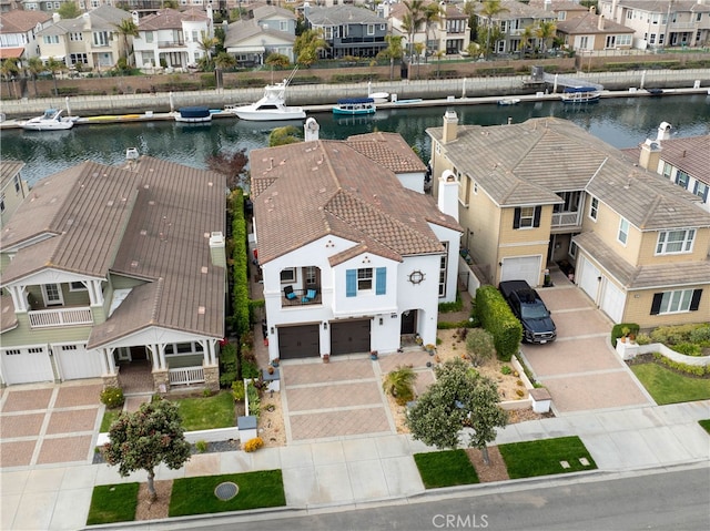 bird's eye view with a water view and a residential view