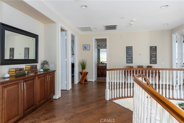 4027 W Hemlock St, Oxnard, CA 93035 - hall featuring an upstairs landing, dark wood-style floors, recessed lighting, and baseboards
