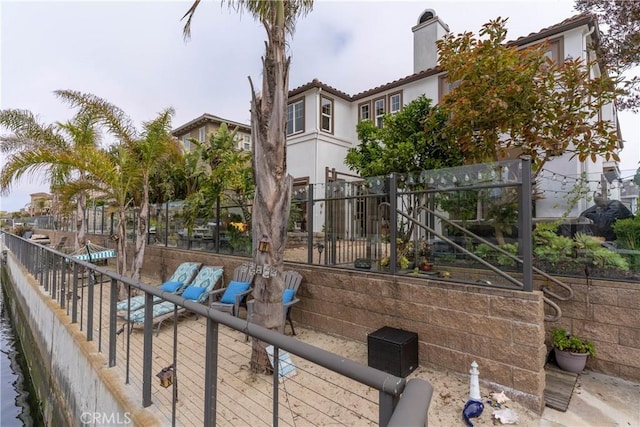 view of patio featuring fence