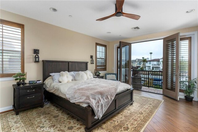 bedroom featuring access to outside, ceiling fan, recessed lighting, wood finished floors, and visible vents