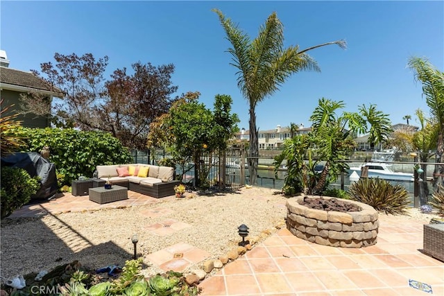 4027 W Hemlock St, Oxnard, CA 93035 - view of patio with an outdoor living space with a fire pit and a fenced backyard