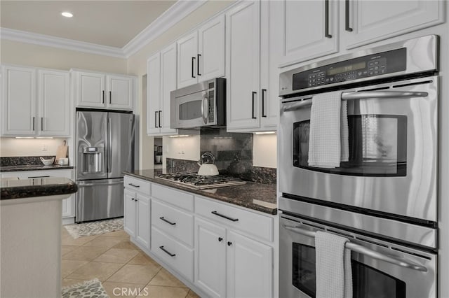 955 Union St, Cherry Valley, CA 92223 - kitchen featuring stainless steel appliances, ornamental molding, white cabinets, dark stone counters, and recessed lighting
