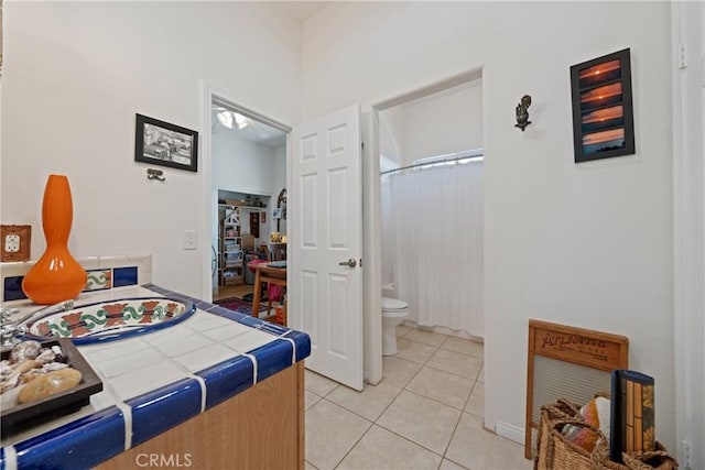 54030 Eisenhower Dr, La Quinta, CA 92253 - bedroom with light tile patterned flooring and ensuite bath