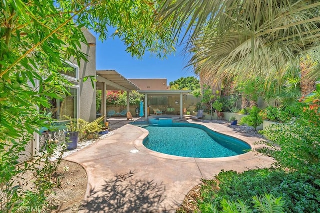 54030 Eisenhower Dr, La Quinta, CA 92253 - view of swimming pool with a patio, an in-ground hot tub, and a fenced backyard