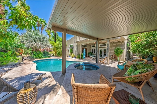 54030 Eisenhower Dr, La Quinta, CA 92253 - view of swimming pool featuring a patio area, french doors, and an in-ground hot tub