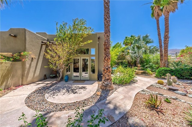 54030 Eisenhower Dr, La Quinta, CA 92253 - view of patio / terrace featuring french doors