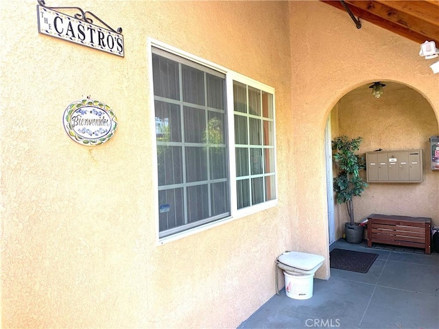 doorway to property with stucco siding