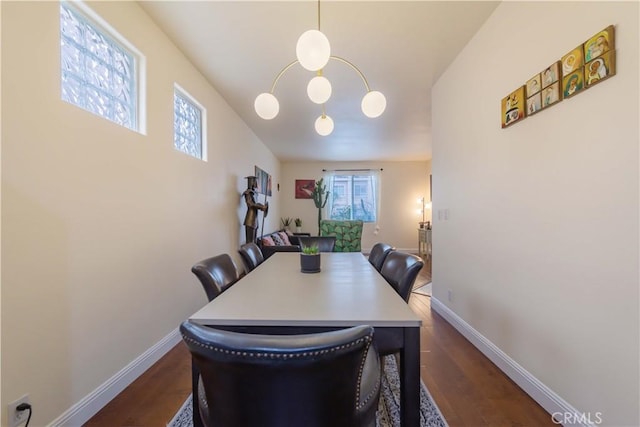 11175 Reagan St, Los Alamitos, CA 90720 - dining space with baseboards and dark wood-type flooring
