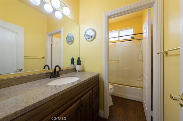 11175 Reagan St, Los Alamitos, CA 90720 - full bathroom with vanity, toilet, wood finished floors, and shower / tub combination