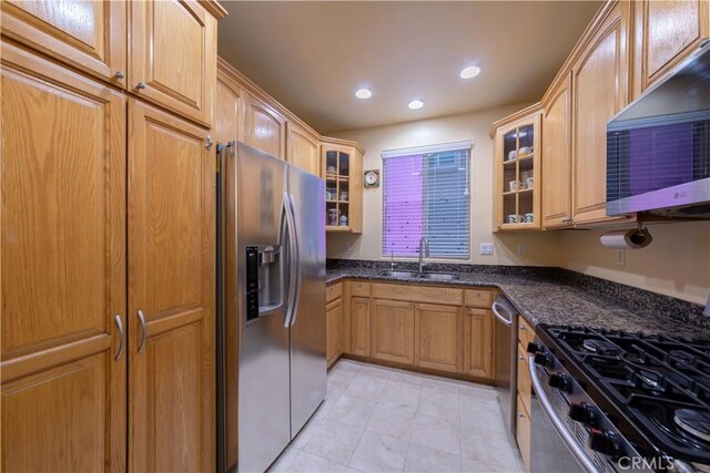 11175 Reagan St, Los Alamitos, CA 90720 - kitchen featuring appliances with stainless steel finishes, a sink, glass insert cabinets, recessed lighting, and light tile patterned flooring