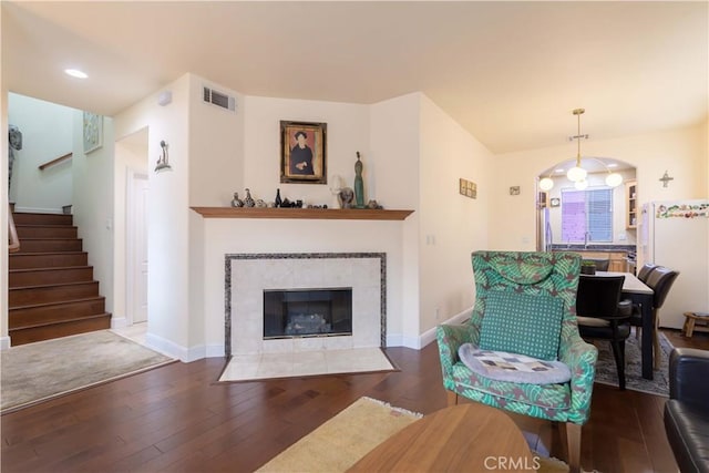 11175 Reagan St, Los Alamitos, CA 90720 - living room featuring baseboards, visible vents, stairway, and hardwood / wood-style floors