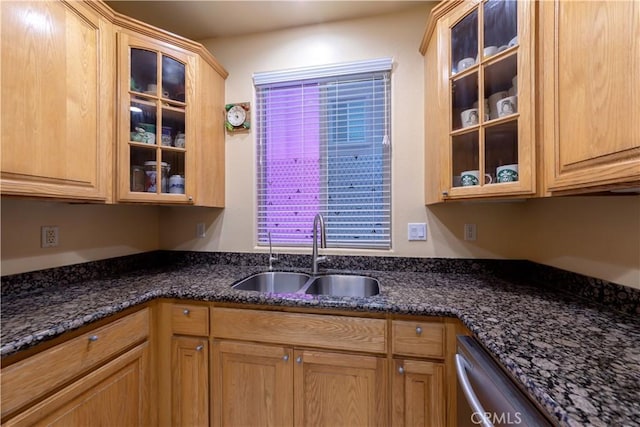 11175 Reagan St, Los Alamitos, CA 90720 - kitchen with stainless steel dishwasher, a sink, dark stone counters, and glass insert cabinets