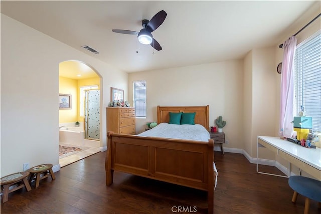 11175 Reagan St, Los Alamitos, CA 90720 - bedroom with arched walkways, baseboards, visible vents, and dark wood-style floors
