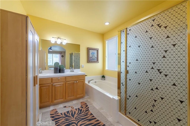 11175 Reagan St, Los Alamitos, CA 90720 - bathroom featuring double vanity, a sink, a bath, and a stall shower