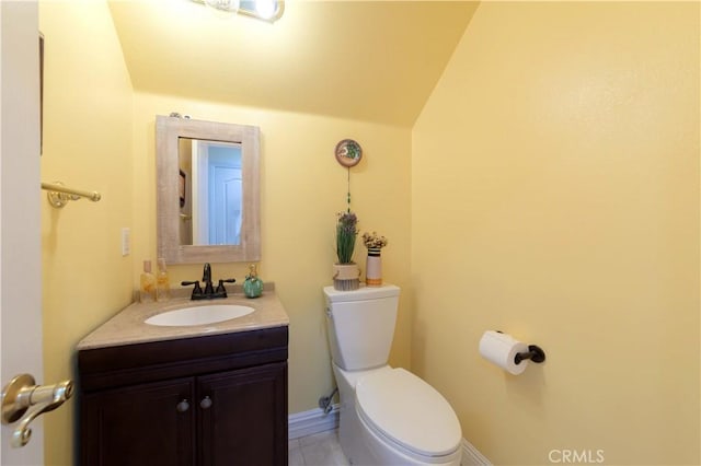 11175 Reagan St, Los Alamitos, CA 90720 - half bath with toilet, tile patterned floors, lofted ceiling, and vanity