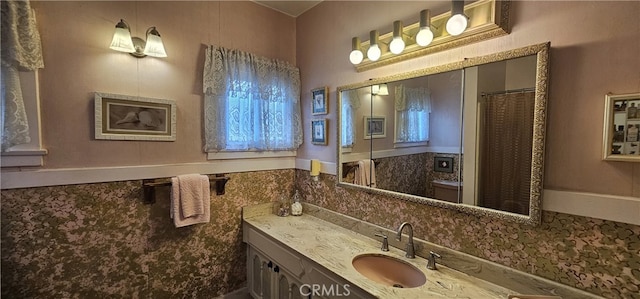 full bathroom featuring vanity and a shower with curtain