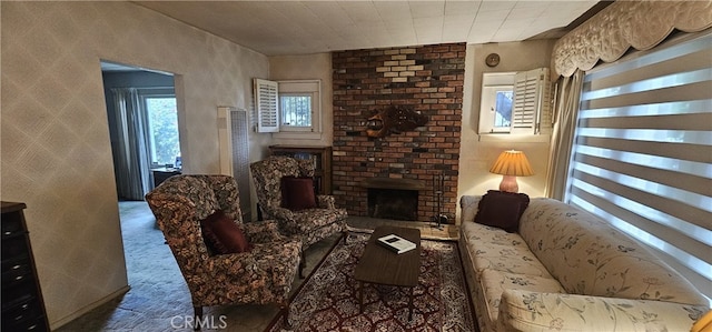 living room with carpet and a fireplace
