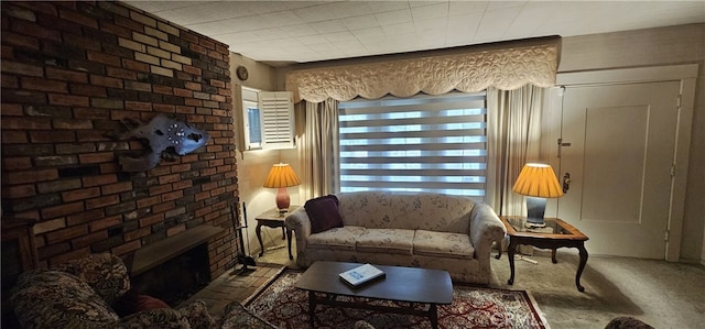 carpeted living area with a fireplace
