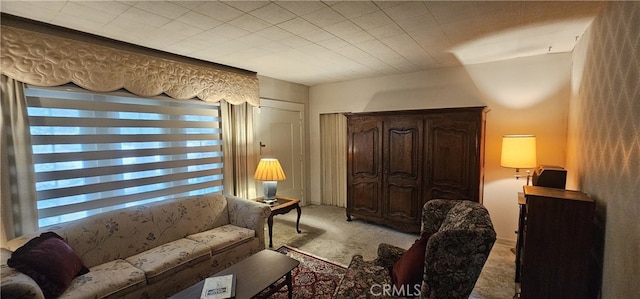 living area with light carpet