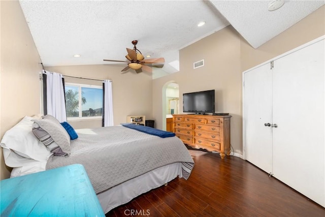 11874 Cornell Ln, Yucaipa, CA 92399 - bedroom with vaulted ceiling, a textured ceiling, arched walkways, wood finished floors, and ceiling fan