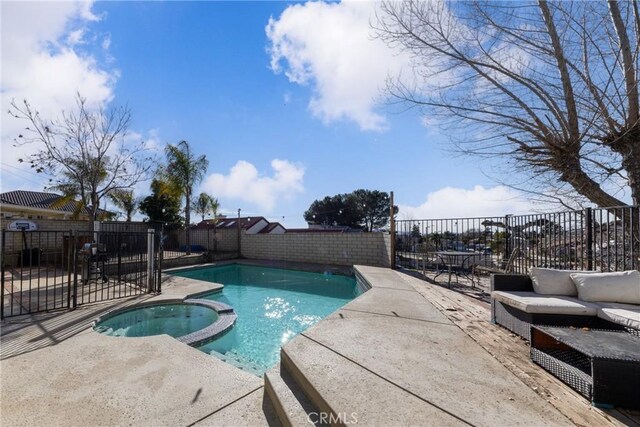 11874 Cornell Ln, Yucaipa, CA 92399 - view of pool featuring a pool with connected hot tub, a patio area, a fenced backyard, and an outdoor hangout area