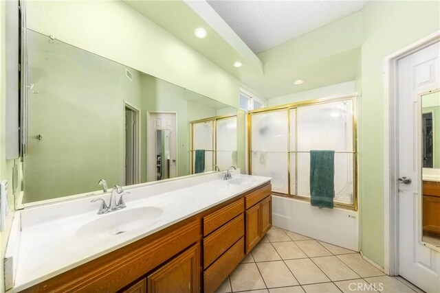 11874 Cornell Ln, Yucaipa, CA 92399 - full bath with double vanity, recessed lighting, tile patterned flooring, and shower / bath combination with glass door