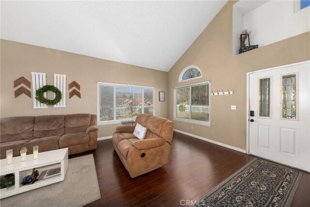 11874 Cornell Ln, Yucaipa, CA 92399 - living area featuring baseboards, dark wood-type flooring, and high vaulted ceiling
