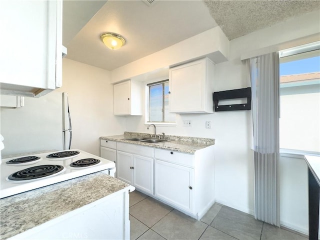 3501 20th St, Highland, CA 92346 - kitchen featuring light countertops, light tile patterned floors, range with electric stovetop, and a sink