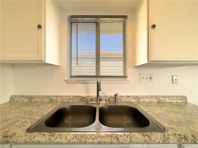 3501 20th St, Highland, CA 92346 - details featuring white cabinetry, light countertops, and a sink