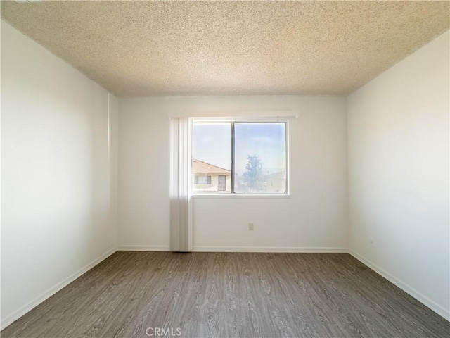 3501 20th St, Highland, CA 92346 - unfurnished room with a textured ceiling, wood finished floors, and baseboards