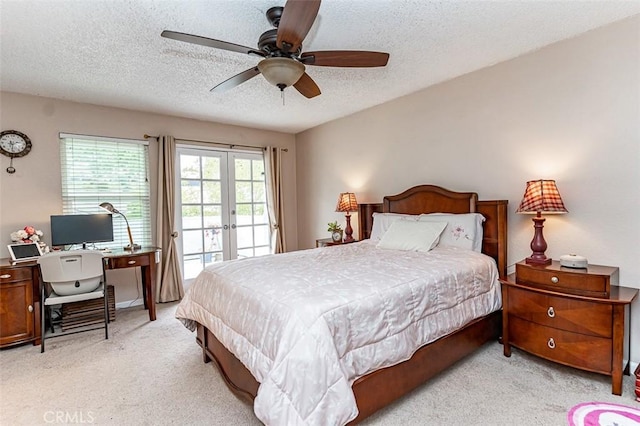 bedroom with access to outside, light carpet, a textured ceiling, french doors, and a ceiling fan