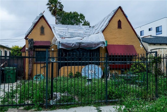 view of gate with a fenced front yard