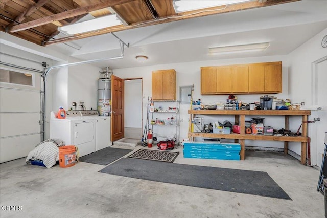 garage with secured water heater and separate washer and dryer