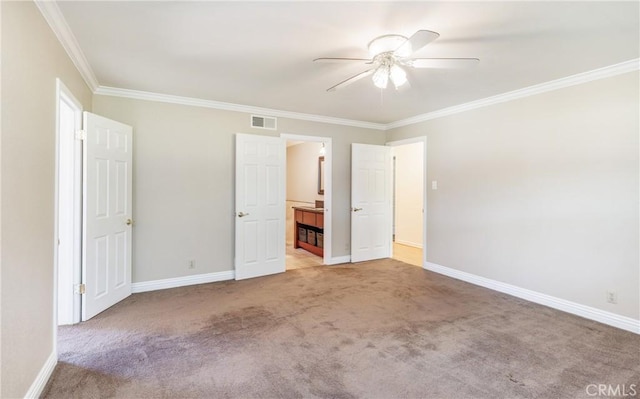 unfurnished bedroom with crown molding, light carpet, baseboards, and visible vents