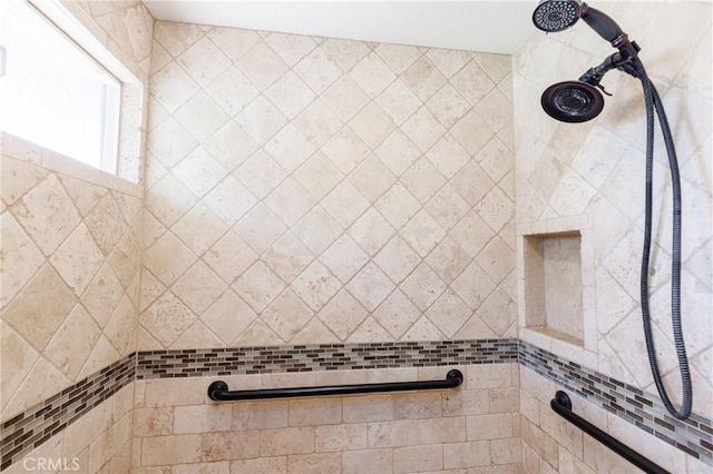 bathroom featuring tiled shower