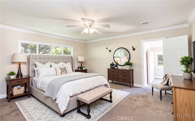 bedroom with baseboards, ceiling fan, visible vents, crown molding, and light carpet